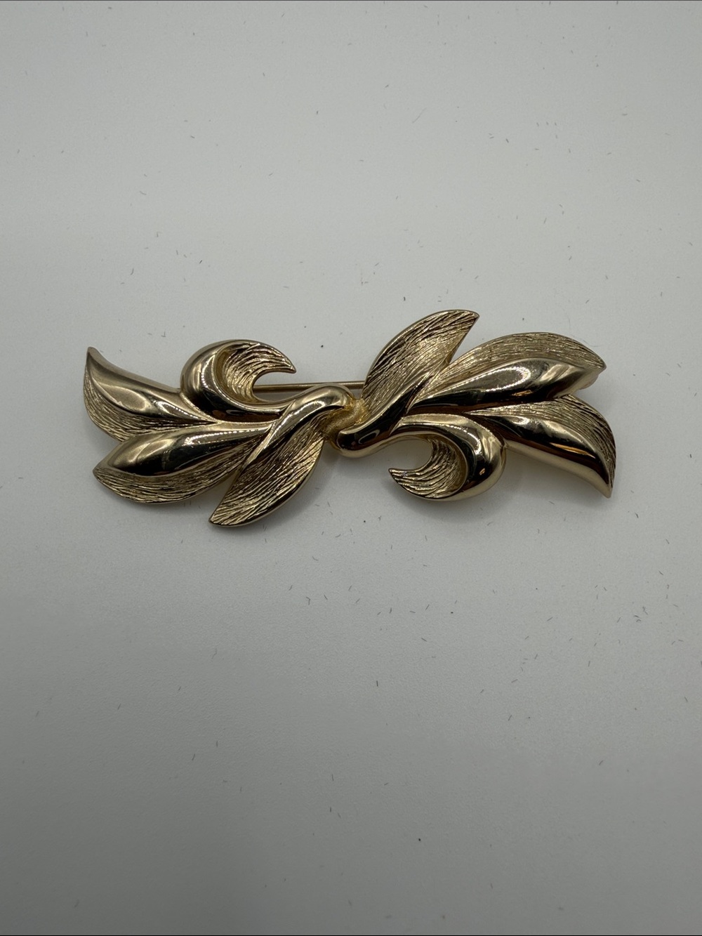 Monet Gold-Tone Leaf Swirl Brooch